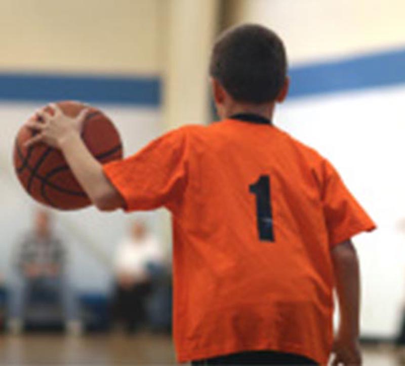 A banner showing kids playing basketball at the Summer Camp at Artistic Sports Complex in Queens, NY. With words on it saying - '2027 Basketball Summer Clinics.'